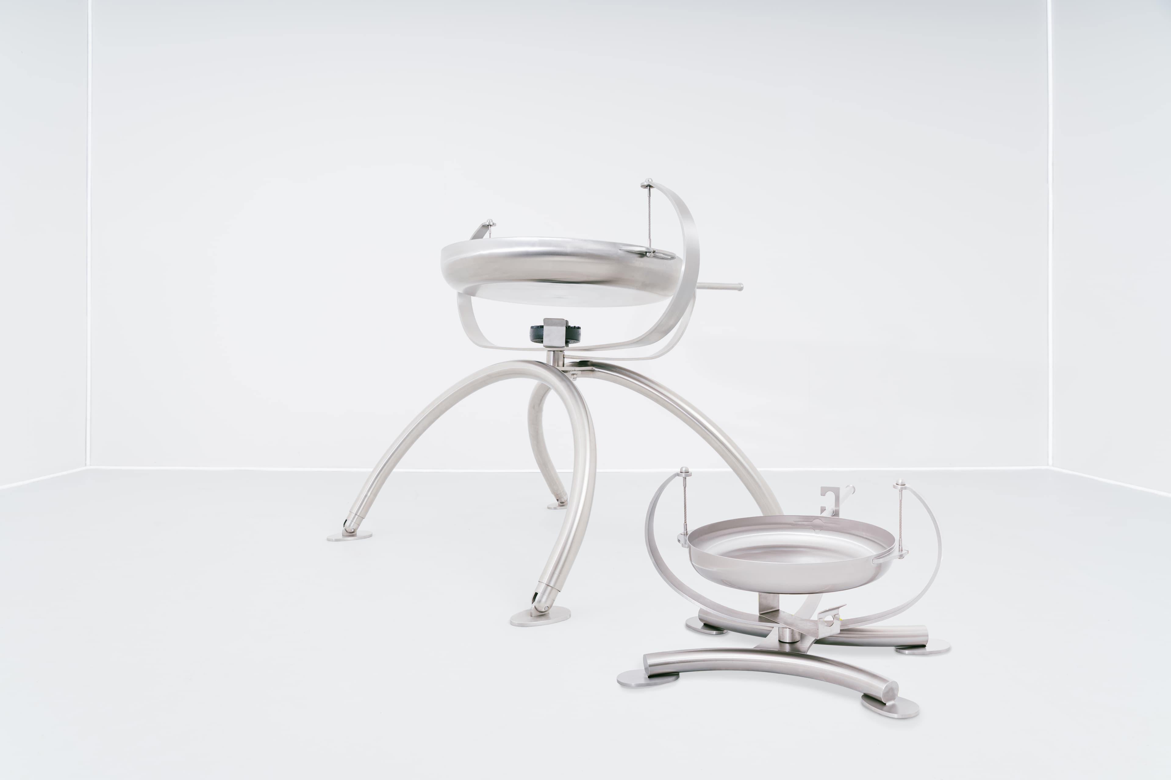 a blue speaker with a wire attached to it